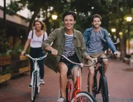 three people riding bicycles