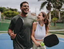 two people playing pickleball